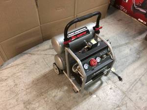 lot 108 image: 4.5 Gal. Portable Electric-Powered Silent Air Compressor by Husky Customer Returns See Pictures