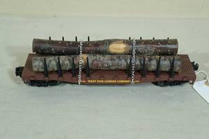 lot 52 image: Lionel 26716 West Side Lumber O Gauge Car with Logs - Post War