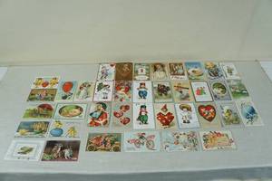 lot 85 image: Antique Early 1900s Postcards - Easter, Valentines, New Years