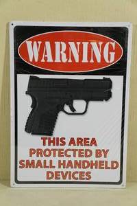 lot 20 image: NEW Tin Warning Sign Protected By Small Handheld Devices