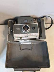 lot 33 image: Vintage Polaroid Automatic 340 Land Camera with Accessories and Case - A
