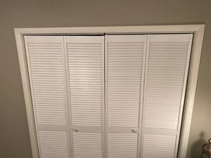lot 130 image: White Bi Fold Louvered Closet Doors - T
