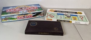 lot 275 image: Lot of 3 Board Games Deluxe Edition Monopoly, Twin Cities Monopoly, & Scrabble - B