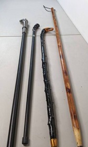 lot 308 image: Set of (4) Walking Sticks Sword Cane, Wolf, Wood, & More - B