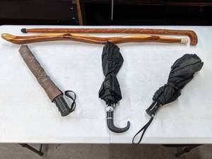 lot 523 image: Assorted Umbrellas and Wood CanesHiking Sticks Lot -E