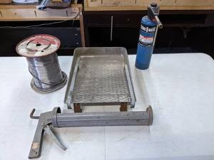 lot 552 image: Lot of Miscellaneous Garage Items - Paint Tray, Soldering Roll, Propane, Caulking Gun - E