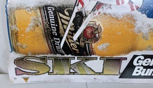 lot 48A image: Miller Genuine Draft Ski Genuine Bumps Tin Beer Sign - N