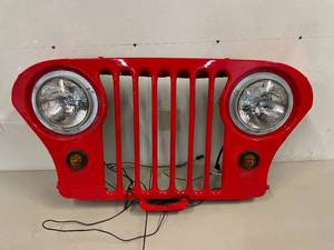 lot 506 image: Bright Red Jeep Vehicle Grill - A