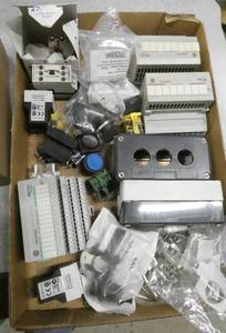 Box of New and used electronic items, Allen Bradley Flex IO modules, Eaton push buttons, fuses