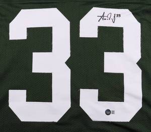 lot 10 image: Green Bay Packers Aaron Jones Signed Green Pro Style Jersey Beckett Authenticated
