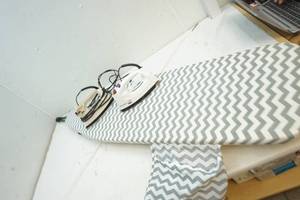 clothes irons and ironing board