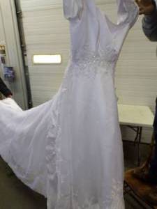 lot 92 image: Gorgeous Size 8 Wedding Dress with Tags  Valued at $799  Needs new Zipper