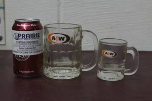 lot 22 image: 2 Matching logo mugs matches logo in 20