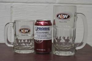 lot 23 image: 2 sided Matching A & W logo mugs dual language