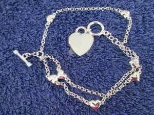 lot 15 image: Silvertone Personalized Heart Charm...