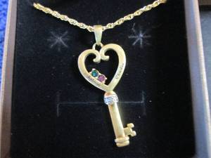 lot 92 image: Goldtone Personalized Simulated Bir...