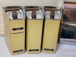 lot 53 image: Vintage Kitchen Canister Set and Foil and Wax Paper Dispenser
