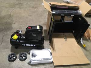 Pallet with Husky Cabinet and Air Compressor in like new condition see pictures