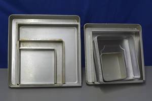 lot 23 image: Assorted square pans see photo for sizes