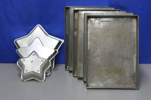 lot 99 image: six 12 sheet pans four star pans