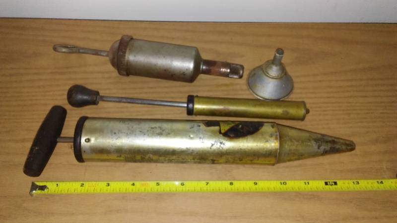 lot 31 image: Vintage - oil cans, cycling tools, camo & bottles.  Big Lot