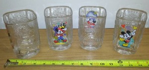 lot 190 image: (4) Disney Glasses- Perfect. McDonalds 2000.