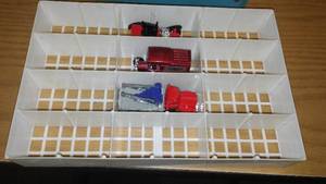 lot 260 image: Hot Wheels 24 case plus cars.