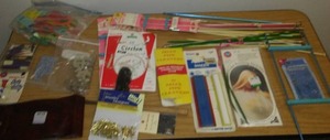 lot 304 image: Knitting needles and needlework accessories.