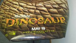 lot 907 image: Disney dinosaur poster, movie theater poster.