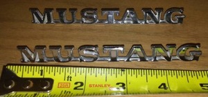 lot 928 image: 2 Ford Mustang Mustang Emblems Badging.