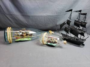 lot 111 image: 2 Ships in Bottles, 1 Tin Model Ship