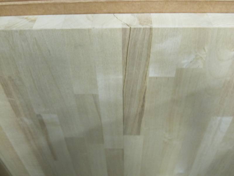 lot 520 image: HARDWOOD REFLECTIONS Unfinished Birch 4 ft. L x 25 in. D x 1.5 in. T Butcher Block Countertop - Crack