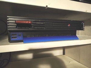 lot 14 image: Sony PlayStation2 with Two Remotes a & 8GB Memory Card