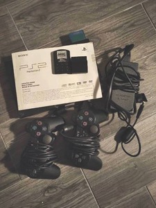lot 15 image: Sony PlayStation2 Slim with Two Remotes & Accessories