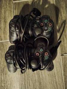 lot 16 image: Two PlayStation2 Remotes
