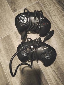 lot 151 image: Two Sega Genesis Remotes