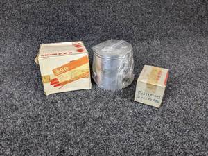 lot 11 image: Lot of (2) Suzuki Pistons Part No. 12110-41202-02512110-41712, Part No. 12110-02750 for 1968 Suzuki 55 M 31 NOS