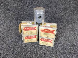 lot 28 image: Lot of (4) Suzuki Pistons Part No. 12110-03960 for 1968 Suzuki 80K10 K11 K15 NOS