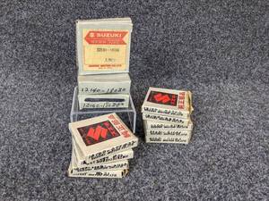 lot 36 image: Lot of (10) Suzuki Piston Rings - Part Nos. 12140-18030, 12140-077 #32, 12140-00031-01120, 12140-M31, 12140-02700, 00031-01125 NOS