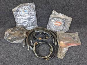 lot 49 image: Lot of Suzuki Starter, Clutch and Other Cables - Parts Nos. 58200-09610, 58410-45121, and more NOS
