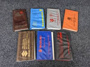 lot 54 image: Lot of (7) Suzuki Motorcycle and ATV Sales Guides from 1982 - 1988