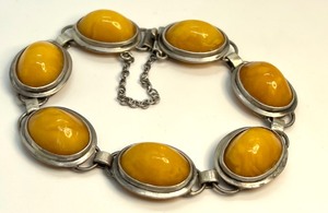 lot 67 image: Sterling (935) and Butterscotch Amber Bracelet