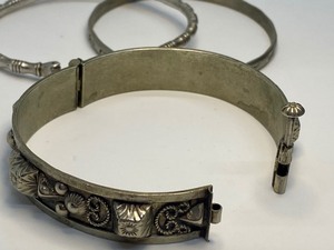 lot 126 image: Three Vintage Bracelets including Pointing Fists Bracelet