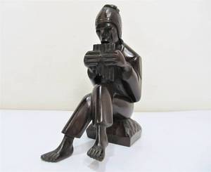 lot 227 image: Juan (J) Ramirez Wood Carver Aymara Mahogany Flute Player Sculpture Bolivia Signed