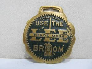 lot 277 image: Old Vintage LEE Brooms Advertising Watch Fob