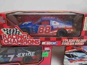 lot 69 image: 4 New in Box Diecast Race Cars