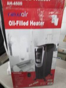 lot 23 image: new air oil filled heater ...