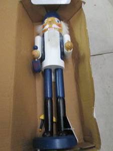 lot 49 image: nutcracker 1 piece needs to be glued...