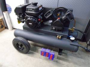New twin tank contractor air compressor. 6.5 hp Kohler motor. Hasnt has oil in it yet. As shown. THIS ITEM HAS A RESERVE.