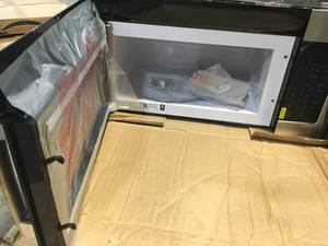 GE 1.6 cu. ft. Over the Range Microwave in Stainless Steel open box see pictures